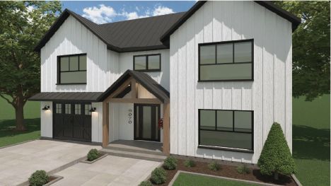 Une maison blanche avec des fenêtres noires et une porte de garage noire.