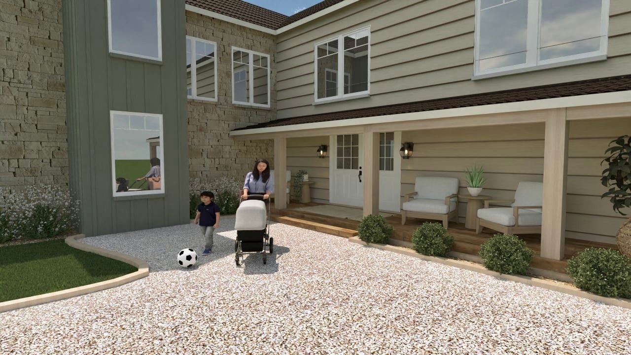 Une femme pousse une poussette devant une maison avec deux enfants.