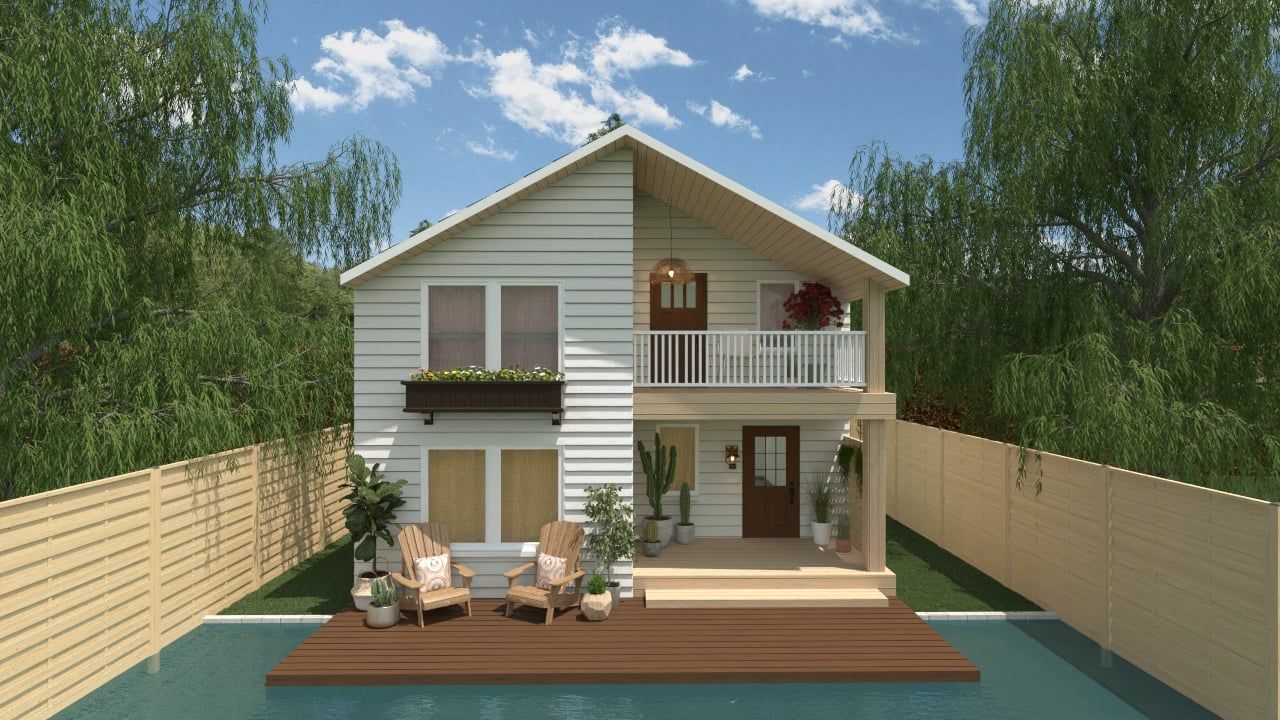 Une maison blanche avec une piscine devant.