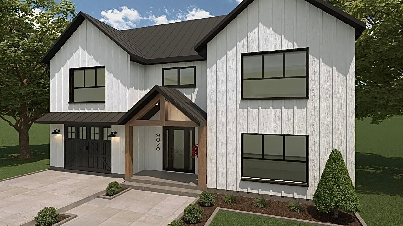 Une maison blanche avec des fenêtres noires et un toit noir est à vendre.