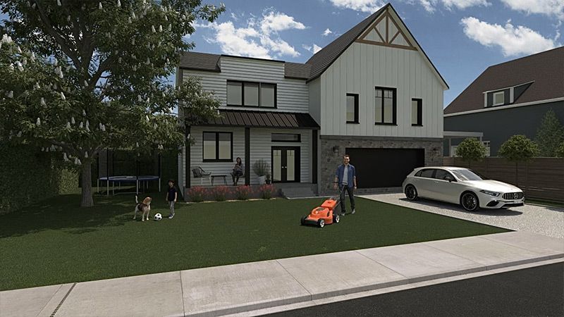 Un homme tond la pelouse devant une maison.