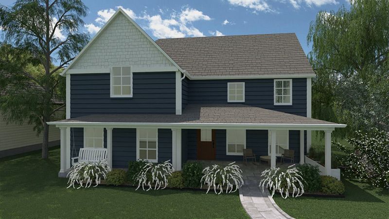 Une maison bleue et blanche avec un grand porche