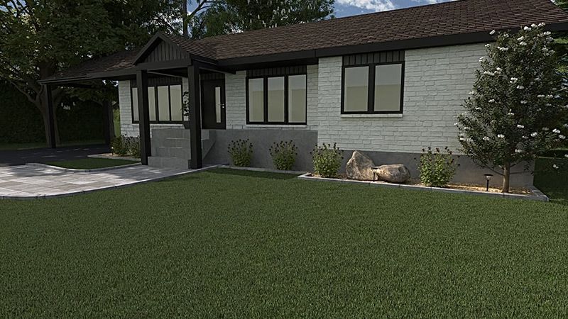 Une maison en briques blanches avec un toit marron et des fenêtres noires se trouve au sommet d'une pelouse verte luxuriante.