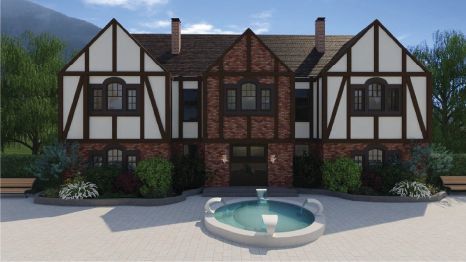 Une grande maison avec une fontaine devant