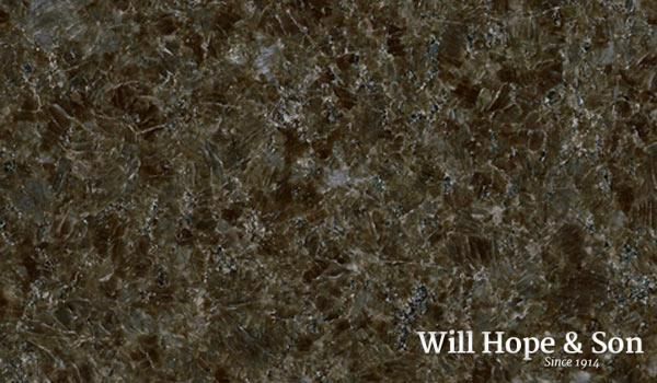 A close up of a brown granite counter top.
