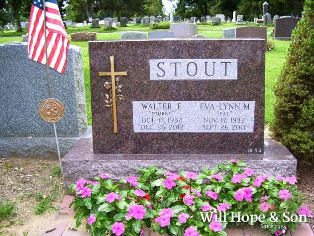 A gravestone for walter e. stout in a cemetery