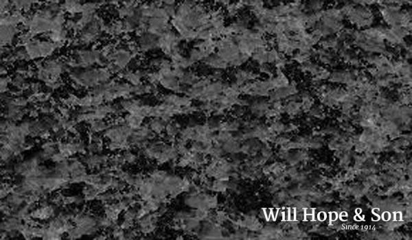 A black and white photo of a rock with the words will hope & son
