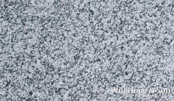 A close up of a gray granite counter top