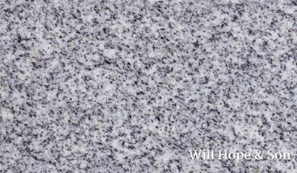 A close up of a gray granite counter top