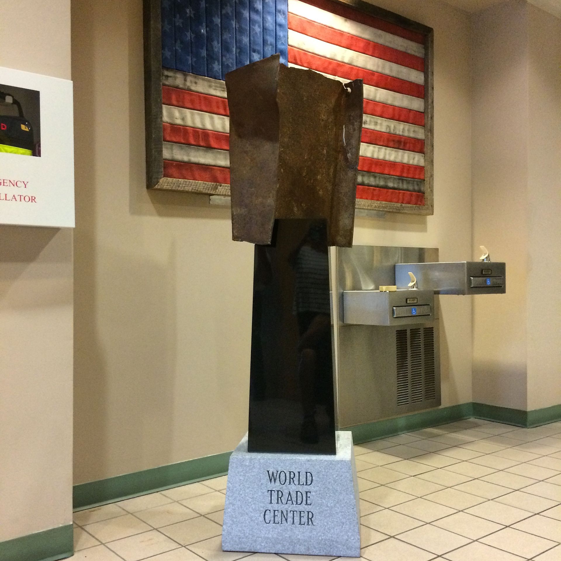 A statue in a room that says world trade center