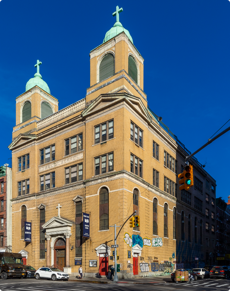 A large building with a cross on top of it