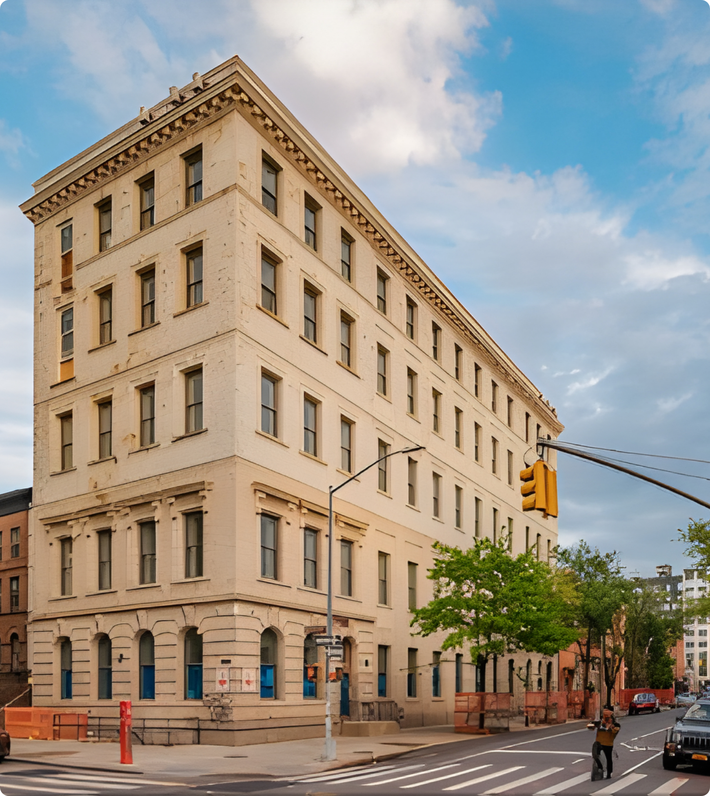 A large building with a traffic light in front of it