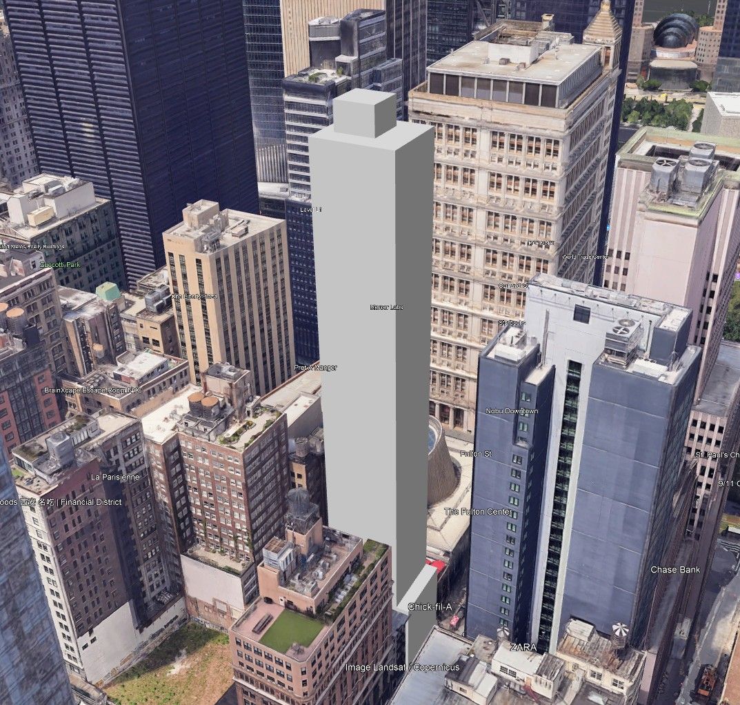 High-angle aerial view of downtown cityscape with a tall, gray skyscraper in the center. Other buildings surround it.