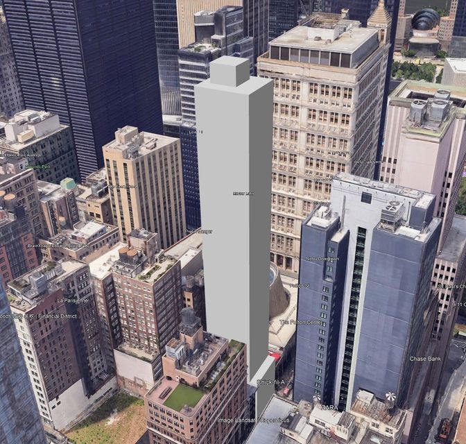 High-angle aerial view of downtown cityscape with a tall, gray skyscraper in the center. Other buildings surround it.