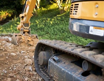 Close up of Excavator Treads — Septic system maintenance in White City, Oregon