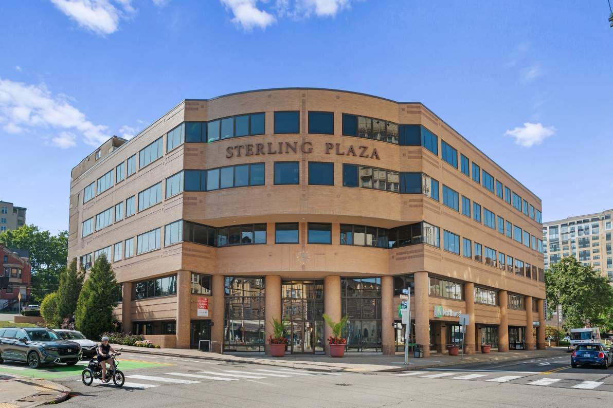 sterling plaza is a large building with lots of windows