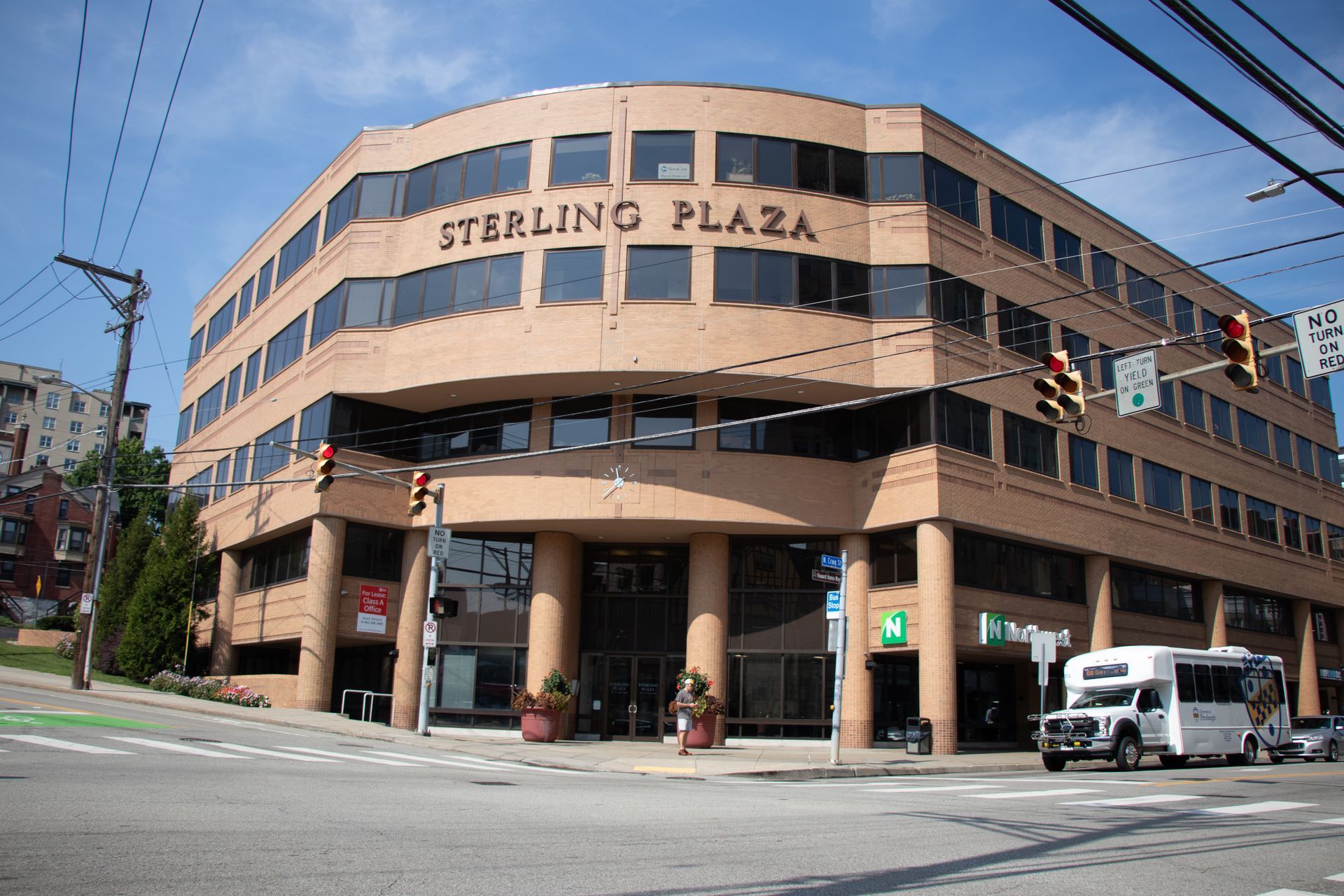 sterling plaza is a large building with lots of windows