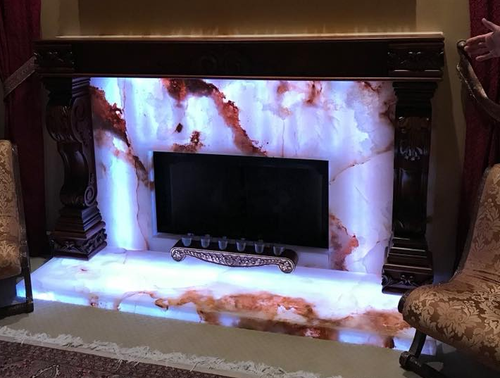 a beautiful picture of marble fireplace fabricated and installed by L&E Marble and Granite