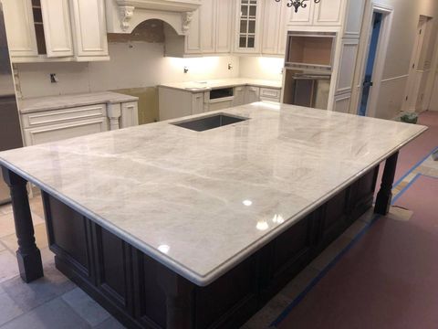 Picture of high end island countertop fabricated and installed by L&E Marble and Granite
