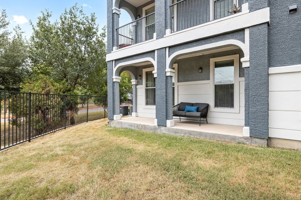 a couch on the porch of a house at Marquis at Crown Ridge in San Antonio, TX.
