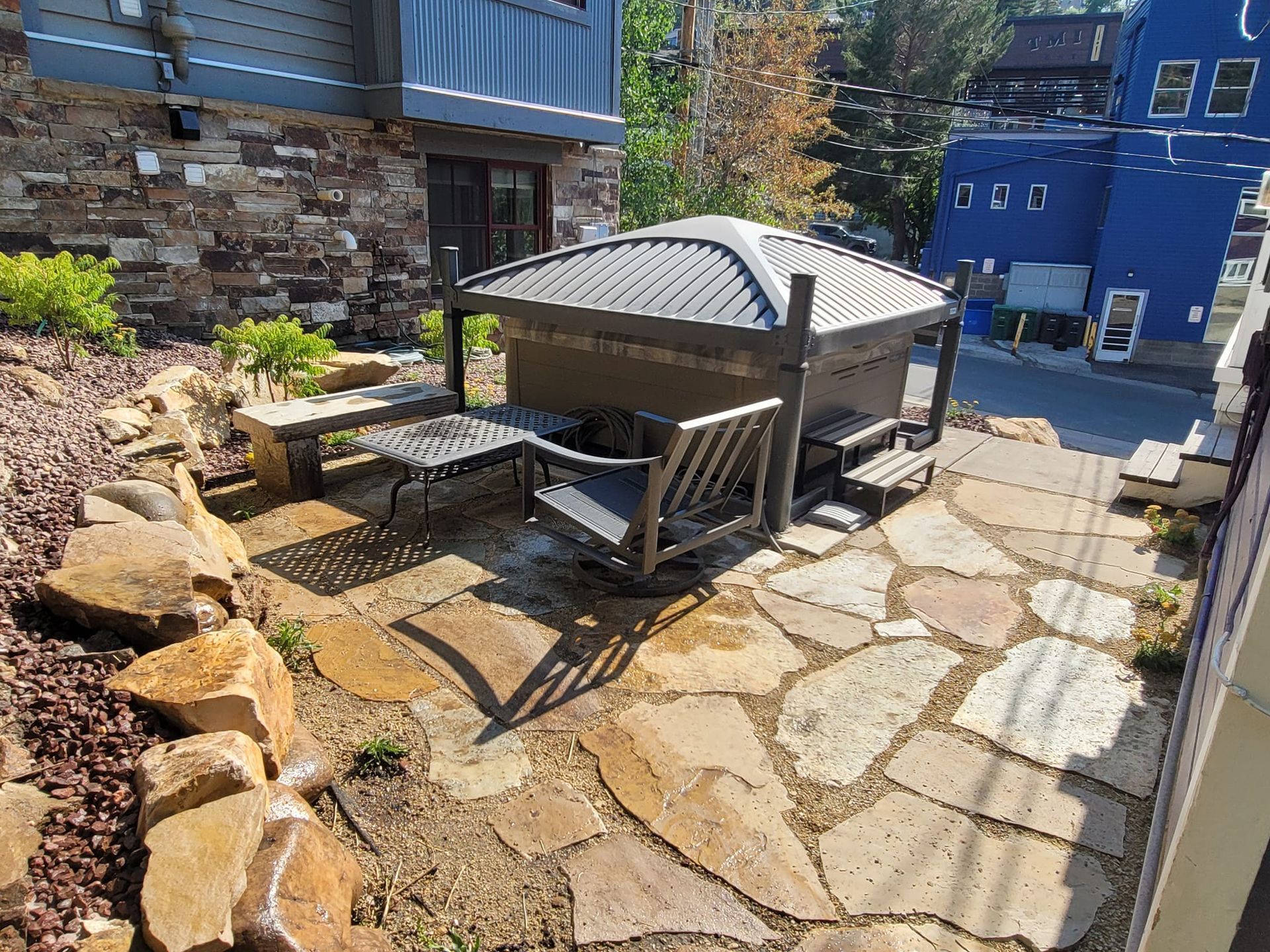 There is a hot tub in the backyard of a house.