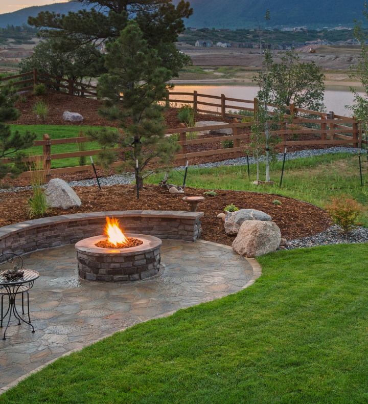 There is a fire pit in the middle of the yard.