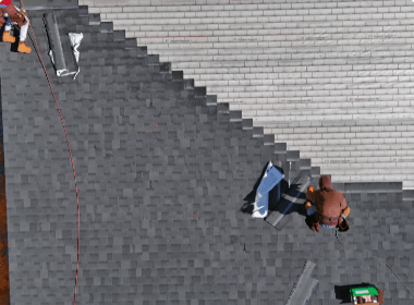 A group of people are working on a roof.