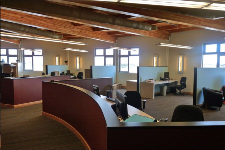 A large office with a lot of desks and chairs