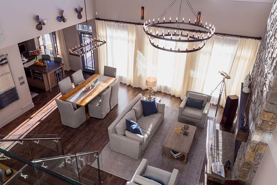 An aerial view of a living room with a couch and chairs