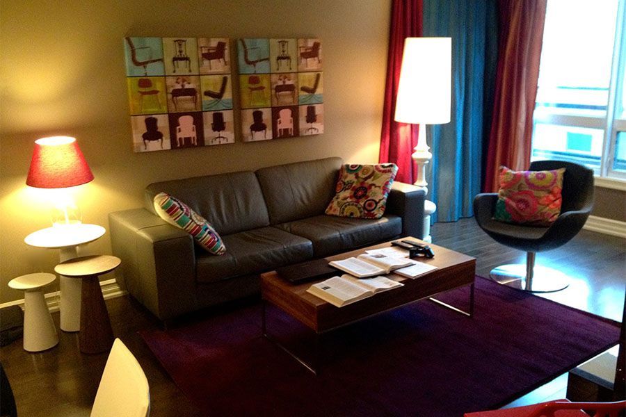 A living room with a couch a chair and a coffee table