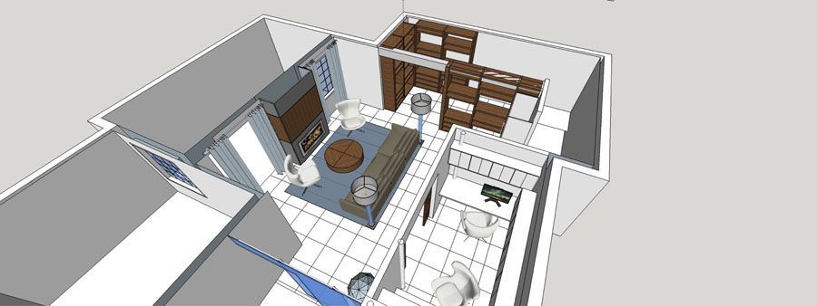 An aerial view of a living room and kitchen in a house.