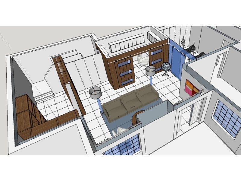 An aerial view of a living room with a couch and stools.