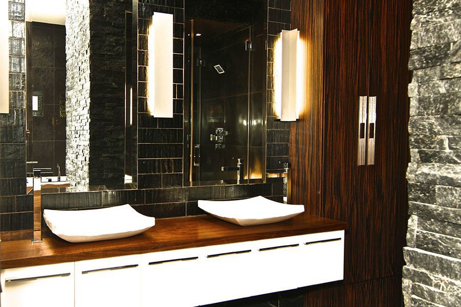 A bathroom with two sinks and a mirror