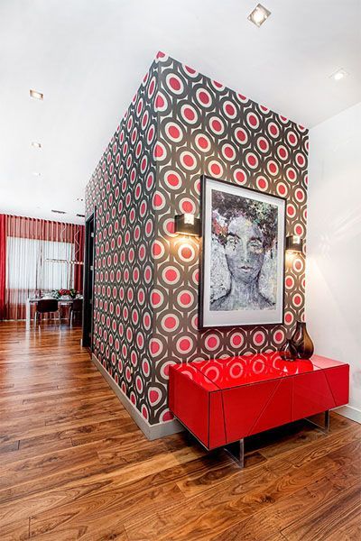 A picture of a woman is hanging on a wall in a hallway.