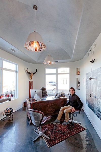 A man is sitting at a desk in an office.