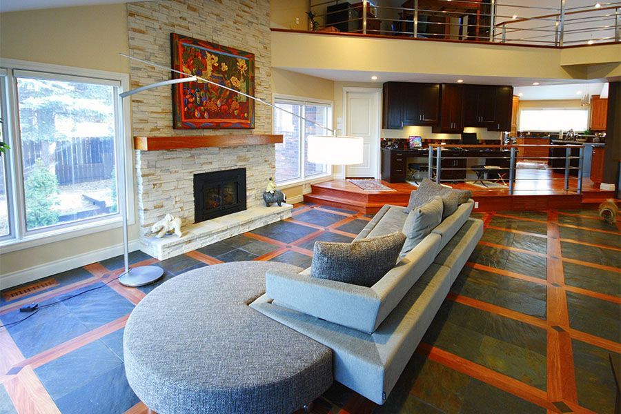 A living room with a couch and a fireplace