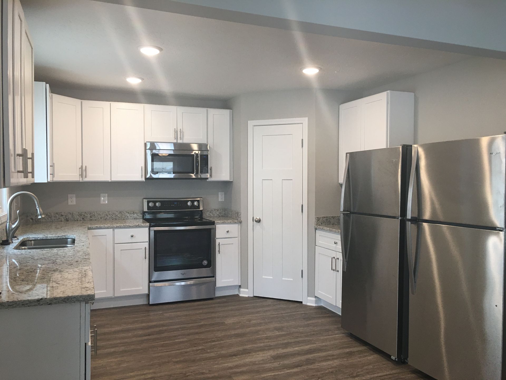 Photo of a kitchen with applieances and a pantry