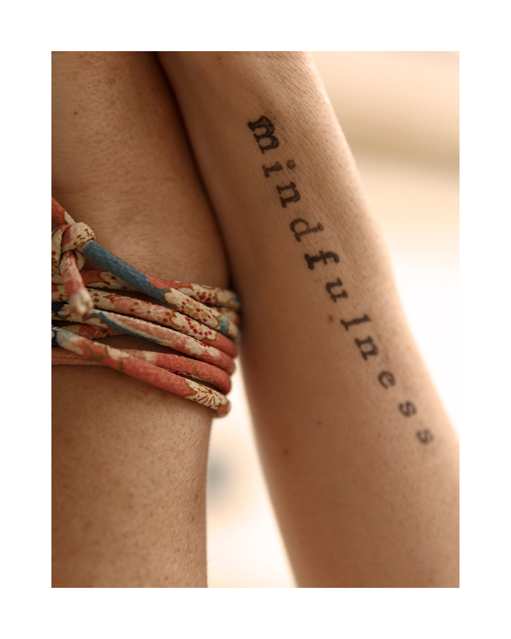Tattoo on arm that reads