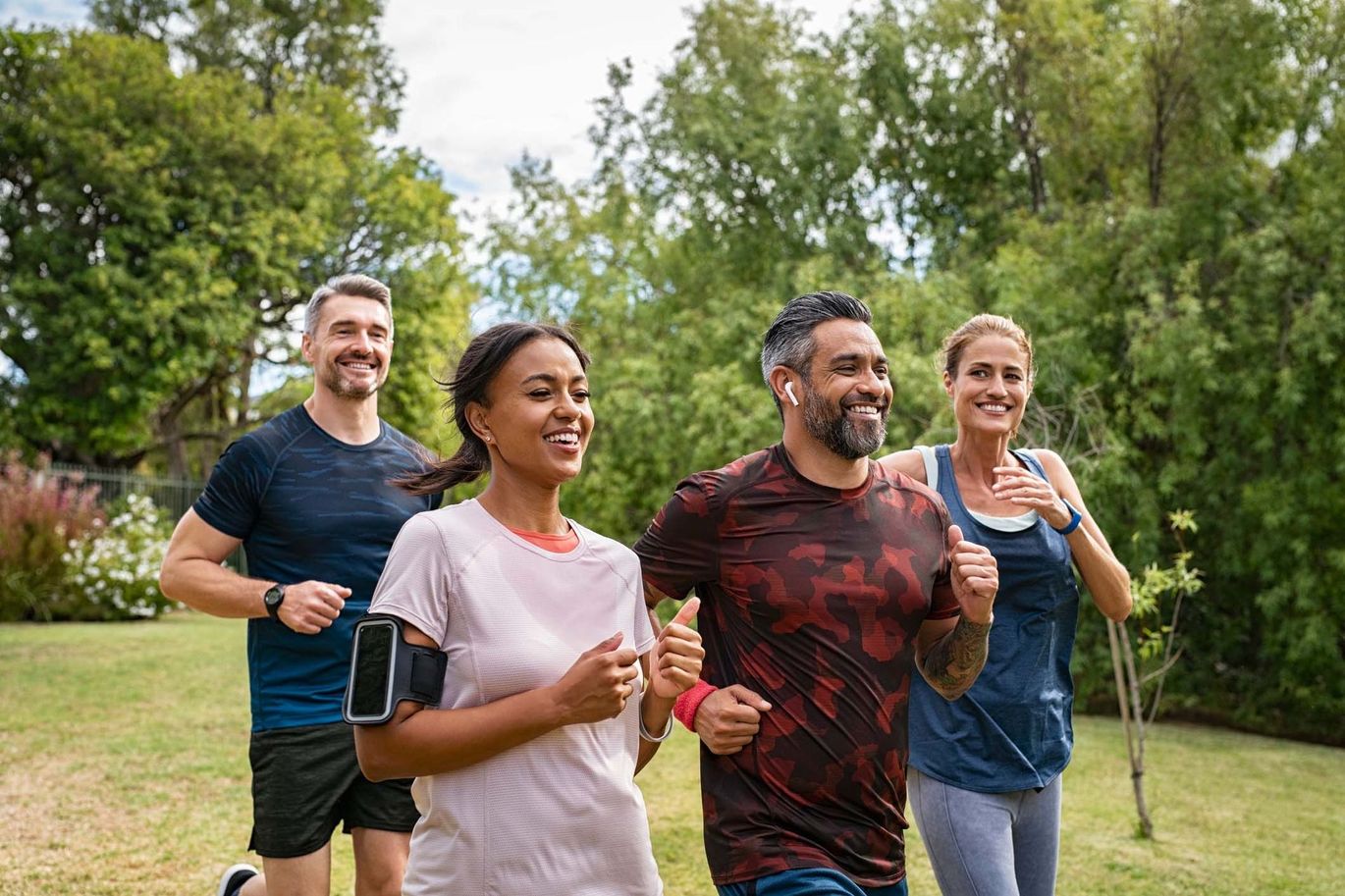 A group of people are running in a park