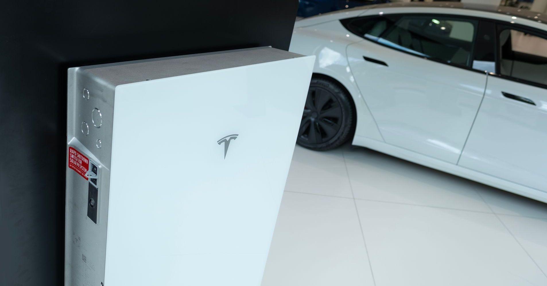 A stack of boxes sitting on top of each other next to a wall.