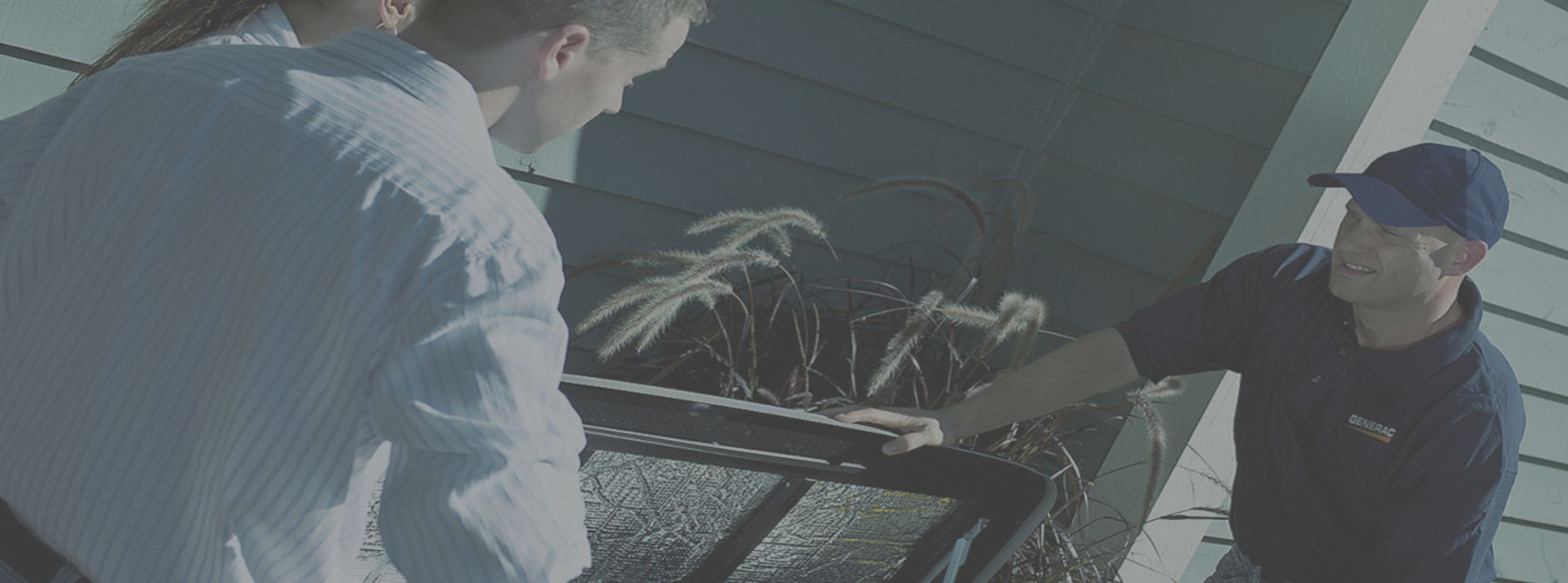 A man and a woman are standing next to each other in front of a building.