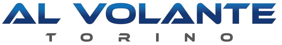 Logo per Al Volante Torino con testo blu in grassetto sopra la parola Torino in lettere maiuscole grigie più piccole.