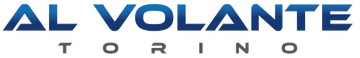 Logo per Al Volante Torino con testo blu in grassetto sopra la parola Torino in lettere maiuscole grigie più piccole.