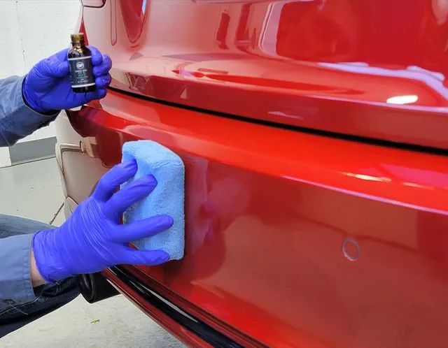 Tesla Model 3 receiving ceramic coating in Cedar City, Utah — premium UV and dust protection.