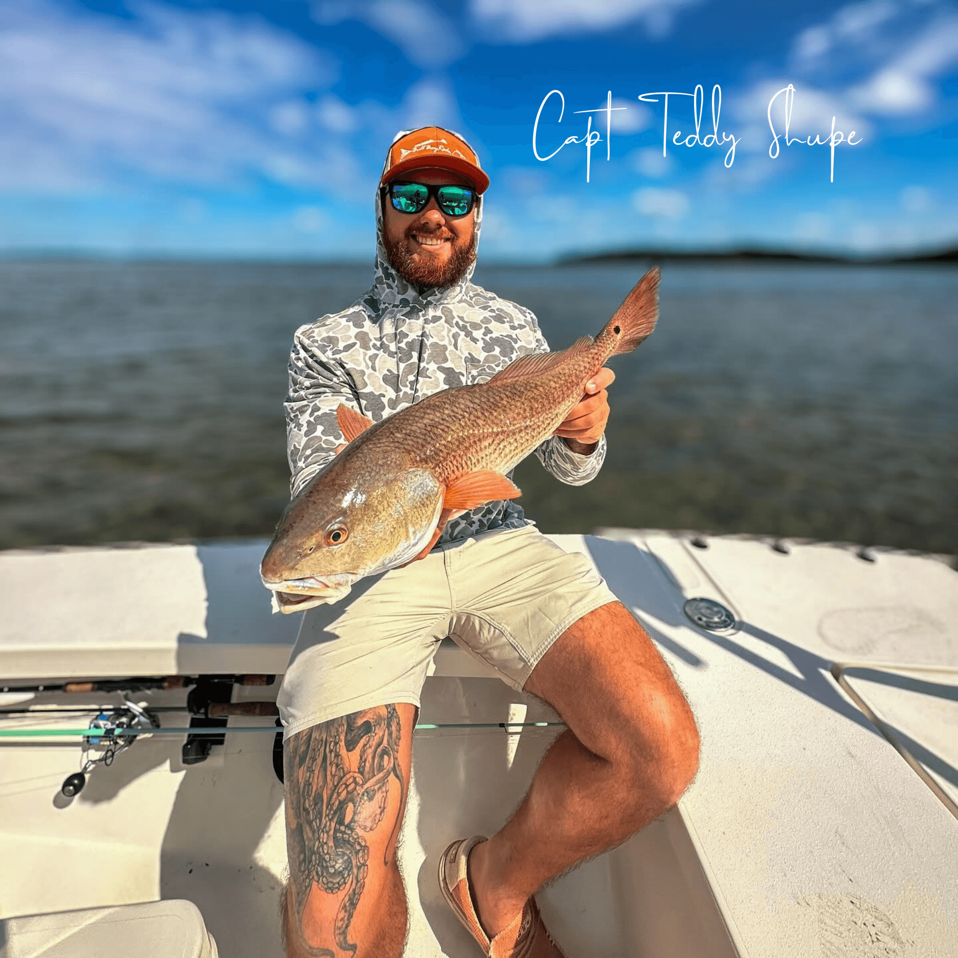 A man is sitting on a boat holding a large fish