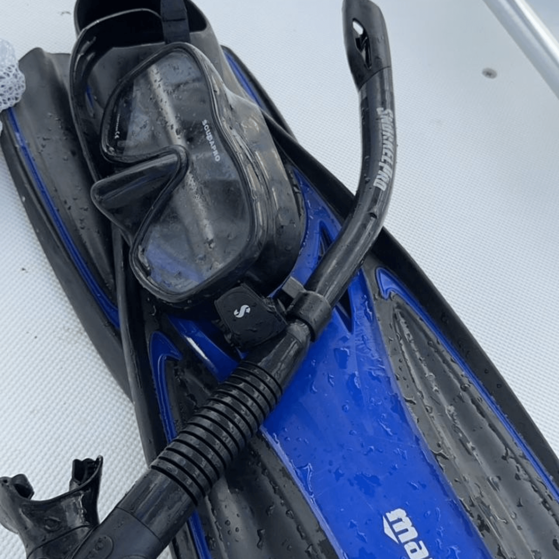 A pair of scuba diving fins with a mask attached to them