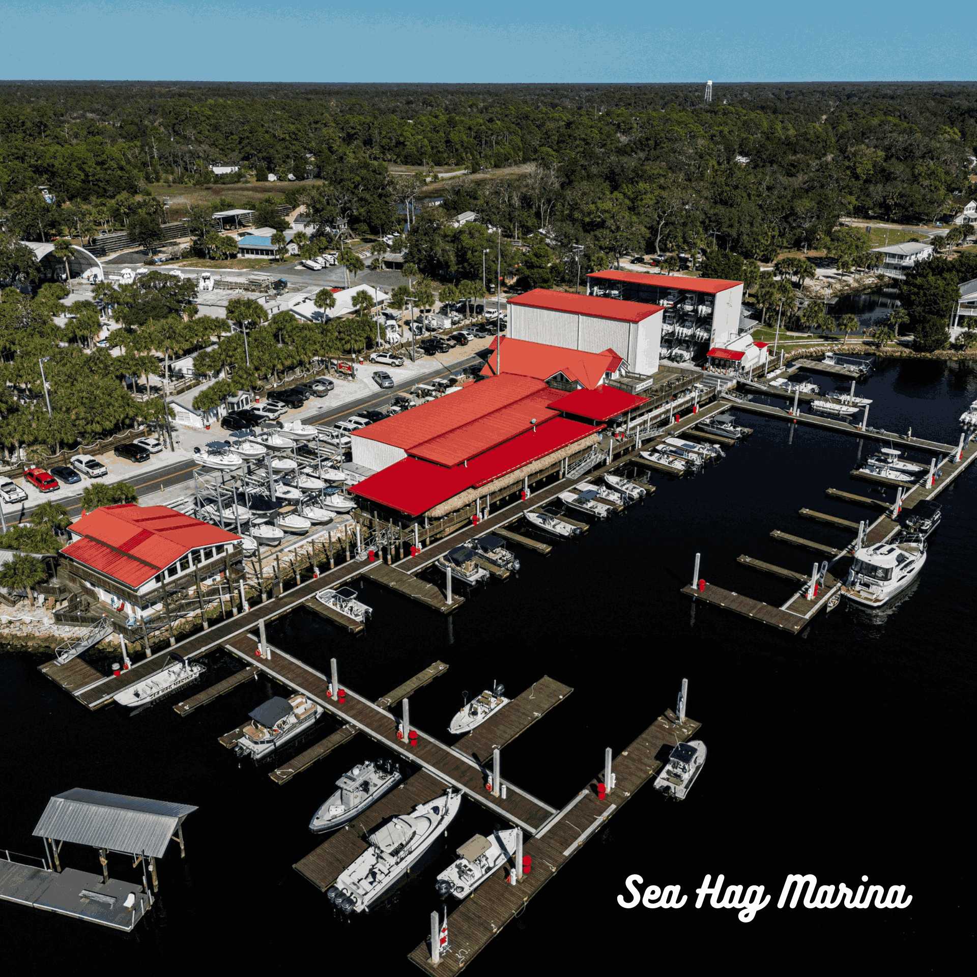 An aerial view of a marina with boats docked at Sea Hag Marina