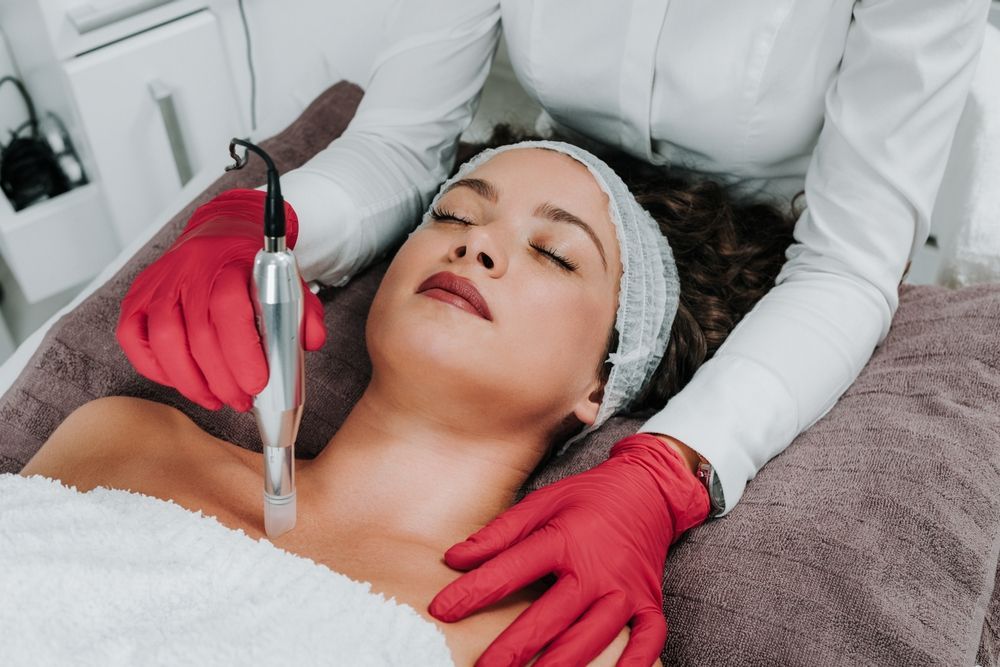 A woman is getting a facial treatment at a beauty salon.