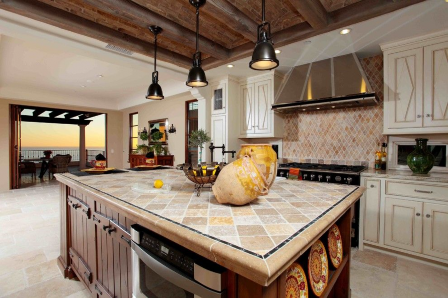 A kitchen with a large island in the middle of it