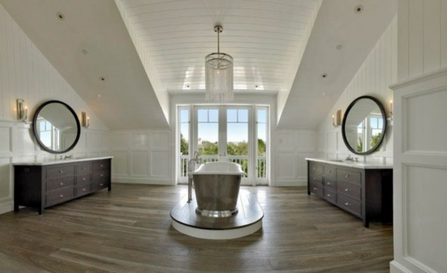 A large bathroom with two sinks and a bathtub
